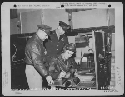 Thumbnail for Consolidated > A Navigator Of The 8Th Air Force In England, Operates A Navigational Training Mock-Up As Major General James H. Doolittle And Brig. Gen. Edmund W. Hill Look On.