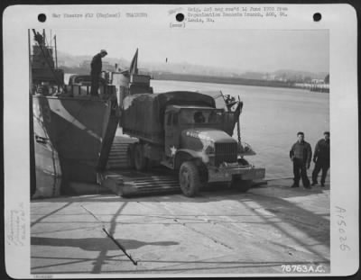 Consolidated > Members Of The 834Th Engineer Aviation Battalion Load Equipment Aboard A Landing Craft During Amphibious Training At Torquay, England.