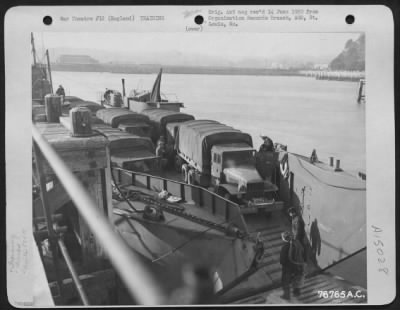 Thumbnail for Consolidated > Members Of The 834Th Engineer Aviation Battalion Load Equipment Aboard A Landing Craft During Amphibious Training At Torquay, England.