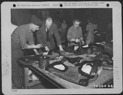 Consolidated > R. Sutherland, Instructor, Instructs Pvt. Henry Andrews Of Cleveland, Ohio, On How To Keep A Self-Sealing Tank In Repair At The Selfsealing Co., John Marstons, Ltd., Wolverhampton, England.  This Is One Of The Classes Set Up By Manufacturers To Insure Max