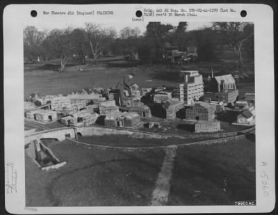 Thumbnail for Consolidated > Lt. William F. Corneilius, Cuyahoga Falls, Ohio, Studies A Problem In The Model Village Used By A Bomb Reconnaissance School At Overcourt Manor, Almondsbury, England.  This Model Village Is Used To Figure Evacuation Problems At To Compute Safety Distances