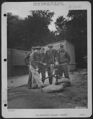 Thumbnail for Consolidated > 1St Lt. John I. Good Of Omaha, Neb., Gives Instructions On A .50 Cal. Gun At The 8Th Air Force Gunnery School At Bovington, England.  His Students Are, Left To Right: S/Sgt. James Supple Of N.Y.C., Lt. Delbert Soderquist Of Moss Lake, Wash., S/Sgt. D.R. M