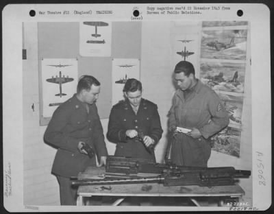 Thumbnail for Consolidated > Gunnery Instruction At An 8Th Bomber Command Air Base, England, Was Constant And Careful.  Here, An Air Force Officer Instructs Enlisted Personnel In The Proper Method Of Assembling A .50 Cal. Machine Gun.