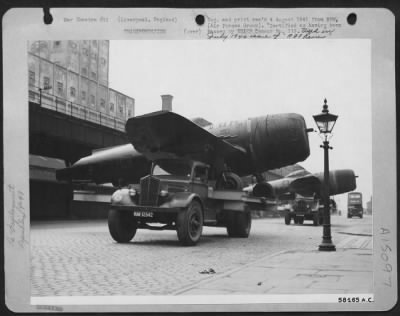 Thumbnail for Consolidated > Re-Deployment -- Fighter Planes - After Dissasembly And Taping, The Now Dingy Looking Republic P-47 Thunderbolts Are Hauled Through The Streets Of Liverpool To The Docks.  This Is A Touchy Business For Many Spots On The 8 Mile Trip From Speke To The Docks