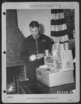 Thumbnail for Consolidated > Officer Of The 493Rd Bomb Group Checking Food Rations Prior To 'Food Mission' Flight.  England, 7 April 1945.