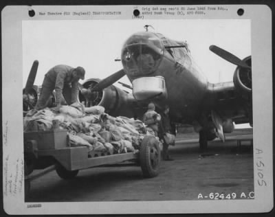 Thumbnail for Consolidated > Personnel Of The 493Rd Bomb Group Loading Food Supplies Into The Boeing B-17 "Flying Fortress" 'Bomb Bay Of Blues' Preparatory To 'Food Mission' Flight.  England, 7 April 1945.