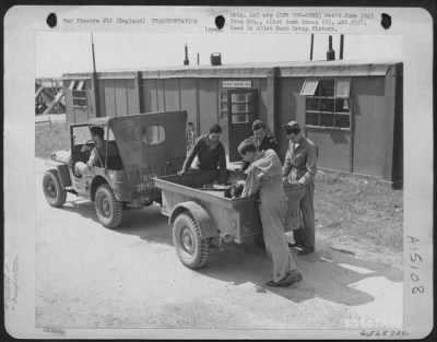 Thumbnail for Consolidated > Men Assigned To 401St Bomb Group Load Equipment Into 2 Wheeled Trailer At An 8Th Air Force Base In England.  15 August 1944.