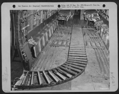 Consolidated > Qm Troops Of The 490Th Qm Depot And The 101St Airborne Division Try Out The British Pannier Basket For Delivering Supplies To Troops On The Ground.  This Photo Shows The Interior Of A Douglas C-47 Equipped With Nine Sections Of Roller Conveyor Which Facil