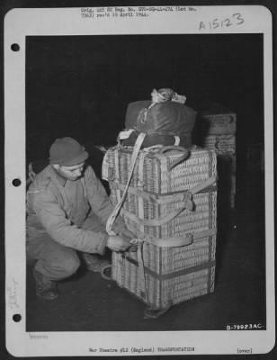 Thumbnail for Consolidated > Qm Troops Of The 490Th Qm Depot And The 101St Airborne Division Try Out The British Pannier Basket For Delivering Supplies To Troops On The Ground.  Here, An Airman Attaches The Harness And Parachute To A Loaded Basket Before Placing It In The Plane.  Ber