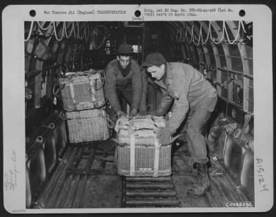 Thumbnail for Consolidated > Qm Troops Of The 490Th Qm Depot And The 101St Airborne Division Try Out The British Pannier Basket For Delivering Supplies To Troops On The Ground.  Here, Men Push A Basket Over The Roller Conveyor Inside The Plane Toward The Door Where It Will Start Its