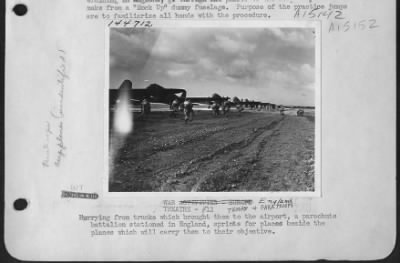 Consolidated > Hurrying From Trucks Which Brough Them To The Airport, A Parachute Battalion Stationed In England, Sprints For Places Beside The Planes Which Will Carry Them To Their Objective.