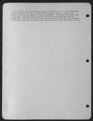 Consolidated > On The Platform, The Train Guard, Ticket Collector And A U.S. Transportation Corpsman Shepherd The Men And Their Bulky Equipment Aboard.  This Is One Journey They Will All Agree Is 'Really Necessary'.  This Train Will Take Them To Greenock, Scotland, Wher