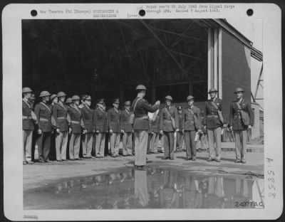 General > Orders are read presenting Major Charles C. Kegelman with the Distinguished Service Cross and Lt. Randal M. Dorton, T/Sgt. Robert L. Golay and Sgt. Bennie B. Cunningham with the Distinguished Flying Cross for their low altitude bombing raid on