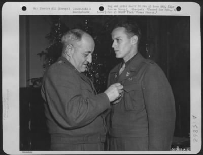 Thumbnail for General > Major General Ralph Royce pins the Air Medal on his aide, Capt. John Lee Frisbee, 31 Cherry Street, Oneonto, N.Y. Capt. Frisbee, a Republic P-47 Thunderbolt pilot, received the award in recognition of meritorious achievement