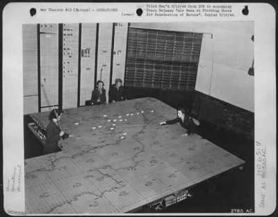 Thumbnail for General > Deepest pentration into German-occupied Europe made by long-range fighter planes of the U.S. Army 8th Air force is plotted on this map table, with WACS engaged in charting the course to and from the target area. This quartet enlisted in the WACS