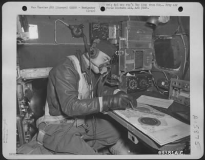 General > The Navigator Of A 91St Bomb Group Boeing B-17 "Flying Fortress" Charts The Course Of His Plane Enroute To Bomb Enemy Installations Somewhere In Europe On 5 November 1943.