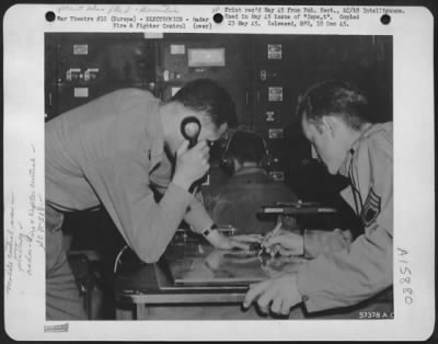 Thumbnail for Radar > Europe - Interior View Of An Scr-584 Station Shows The Controller (At Left) By His Plotting Table Inside The Truck. This Table Has On It A Map Of The Target Area In Relation To The Radar'S Position.  Controller Follows The Line Of Flight, Which Shows Thro