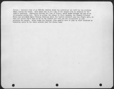 Thumbnail for Radar > Europe - Interior View Of An Scr-584 Station Shows The Controller (At Left) By His Plotting Table Inside The Truck. This Table Has On It A Map Of The Target Area In Relation To The Radar'S Position.  Controller Follows The Line Of Flight, Which Shows Thro