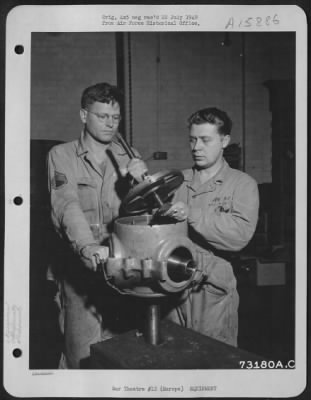 Thumbnail for General > Gi Ingenuity Takes Strange Twists - Gi Gadgets Have Saved Many Hours And Made Tedius Tasks Easier.  Shown Is A Device Separating The Two Halves Of The Propeller Hub, Held By T/Sgt. William E. Dieck Of Sunbury, Pa., While S/Sgt. Arthur J. Monheim Of Ottowa