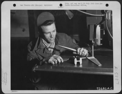 Thumbnail for General > Gi Ingenuity Takes Strange Twists - Gi Gadgets Have Saved Many Hours And Made Tedius Tasks Easier.  Here, M/Sgt. Earl E. Lippincott Of Mt. Holly, N.J. Demonstrates His Investion Of The Taper Pin Gauge.  This Device Saves Lost Time In Fitting Taper Pins In