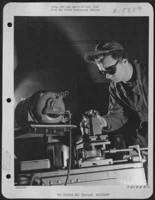 Thumbnail for General > Gi Ingenuity Takes Strange Twists - Gi Gadgets Have Saved Many Hours And Made Tedius Tasks Easier.  Here, M/Sgt. Frank J. Kuret Of Cleveland, Ohio, Demonstrates A Machine For Grinding Milling Machine Cutters Which He Made From And Old Brake Shoe Grinder A