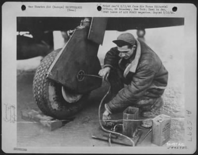 Thumbnail for General > A 'Big-Time-Operator' In The Eto, M/Sgt. Alfred J. Gouba, Shenandoah, Pa., Is Shown Operating His Brake Bleeding Machine On The Brakes Of A Republic P-47.  The Device Was Constructed Out Of Salvaged Material.