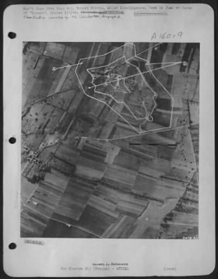 Consolidated > Defended Radar Station at Douvres-La-Deliverance, France is surrounded by mine belt, traces of buried mines being visible at A. Barbed wire fence (B) to prevent accidental detonation of mines, on each side of mine belt, is clearly visible.