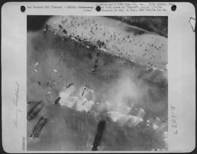 Thumbnail for Consolidated > Aerial view of landing operation on French coast shows three LSTs stuck in shallow water a couple of hundred yards off shore. A line of tanks and vehicles scuttles through heavy surf. Soldiers jam beaches as others swim ashore.