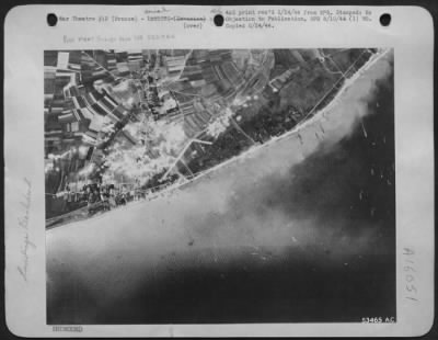 Consolidated > Allied landing craft along the coast of France on Invasion Day 6/6/44.