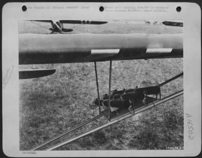 Thumbnail for General > This is a muzzle end view of three bazooka guns mounted on the wing struts of a Piper Cub Artillery liaison plane somewhere in France. Three launchers are attached to each wing of the plane. U.S. Army 9th Air force Service Command Armament