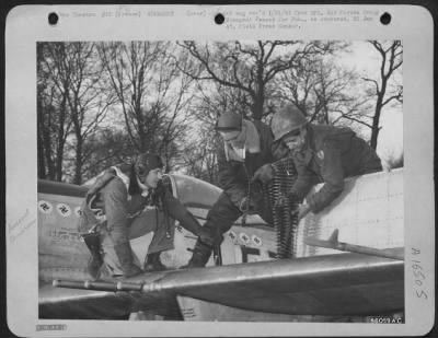 Thumbnail for General > Capt. Kenneth Dahlberg, St. Louis, Mo., and St. Paul, Minn., (left), one of the leading aces of the Ninth Air force with 15.5 enemy planes to his credit, supervises the loading of the machine guns on his Republic P-47 Thunderbolt at a front