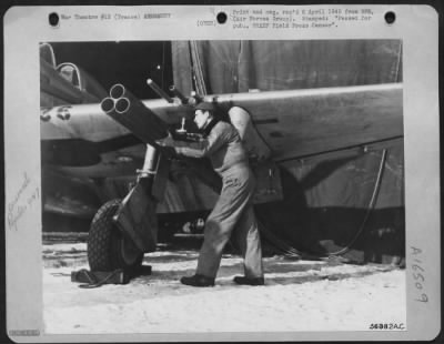 Thumbnail for General > More headaches for Jerry and Company--"Rockets," M/Sgt. Charles R. Smith, Houston Texas, is shown installing a set of Train Destroyers on a Republic P-47 Thunderbolt Fighter-Bomber at a 1st Tac AF Air Depot somewhere in France.