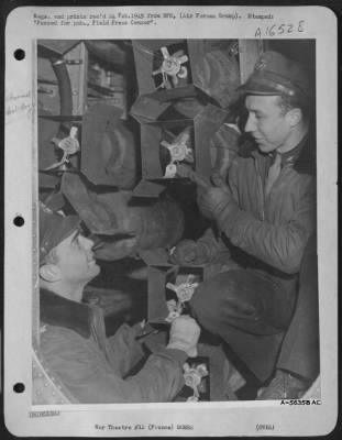 Thumbnail for General > Col. Thomas G. Corbin, left, group commander and pilot of "Rat Poison" and Capt. William E. Smith (now Maj.) crouch in the bomb bay to discuss the Martin B-26 Marauder's 164th mission, just before the take-off. FRANCE.