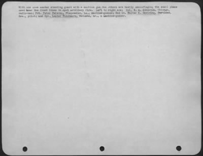 General > With one crew member standing guard with a machine gun the others are busily camouflaging the small plane used near the front lines to spot artillery fire. Left to right are: Cpl. N.A. Atherton, Chicago, radio-man; Pvt. Peter Palermo, Plaquemine, La.