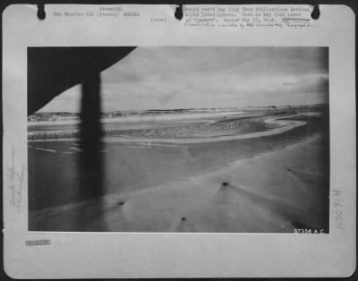 Consolidated > Detailed Information On Normandy Beach Defenses Was Obtained From "Dicing" Shots Like This.  8 Foot Stakes, Constructed Of Steel, Timber Or Concrete, Formed First Line Of Normandy Anti-Boat Defenses.  They Often Had Tellermines Or Shells Pointed Seaward A