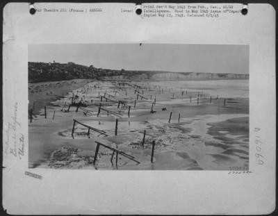 Consolidated > Detailing Information On Normandy Beach Defenses Was Obtained From "Dicing" Shots Like This.  Every Type Of Anti-Landing Obstacle Appears In This Photo, Including Most Formidable, Steel-Concret Hedgehogs, (Left Center) And Tetrahedra In Left Foreground.