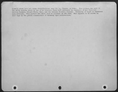 Consolidated > Clearly Shown Here Are Enemy Fortifications Near St. Lo, France, On D-Day.  This Picture Was Made In The Early Morning Hours By Use Of An Electric Flash Bulb Developed By Engineers Of Air Technical Service Command, Wright Field, Ohio, And The General Elec