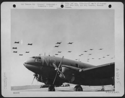 Thumbnail for Curtiss > Formation Of Curtiss C-46 Commandos Passes Over A 9Th Troop Carrier Command Base Somewhere In France.  21 March 1945.  [9Th Air Force 313 Tcg]