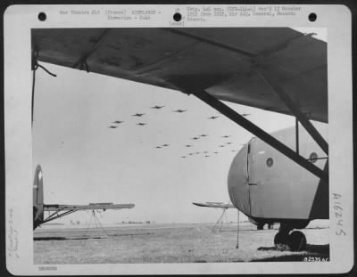 Thumbnail for Douglas > A Formation Of Curtis C-46 Commandos Of The 9Th Troop Carrier Command Passes Over An Allied Airfield Somewhere In France.  21 March 1945.