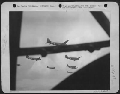 Douglas > Formations Of Douglas C-47S Of The Troop Carrier Air Division Of The Twelfth Air Force, Wing Their Way To Their Dropping Zones To Dislodge Their Cargo Of Fierce And Tough Paratroops.  France.  [Douglas C-47 Transports Of The 53 Tcw, 78 Tcs.]