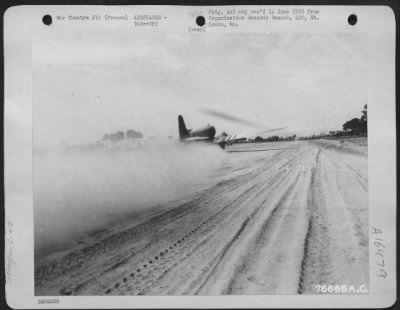 Thumbnail for Douglas > A Douglas C-47 Leaves A Trail Of Dust As It Takes Off From An Airfield In Courtils, France.