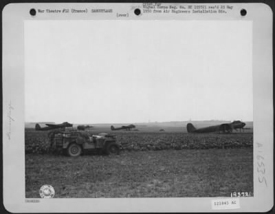 Thumbnail for General > Two American Officers Look Over A Field Of Decoy Ju-88S, Dummy Planes Used As 'Bait' On A Former Nazi Airport At Epinay, France.  These 'Prop' Planes Were Parked On A Section Of The Field Where Bombs Dropped By Allied Bombers Would Do The Smallest Amount