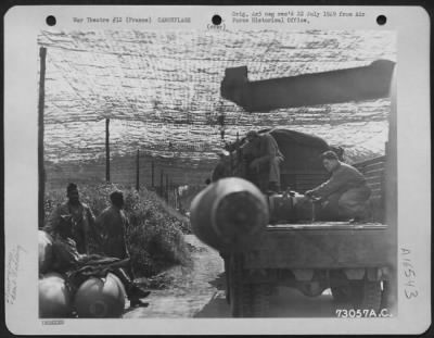 Thumbnail for General > Enlisted Men Load Bombs Onto A Truck At A Camouflaged Bomb Dump, France.