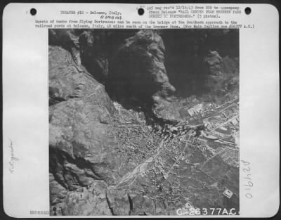 Thumbnail for Consolidated > Bursts of bombs from Flying Fortresses can be seen on the bridge at the Southern approach to the railroad yards at Bolzano, Italy, 40 miles south of the Brenner Pass.