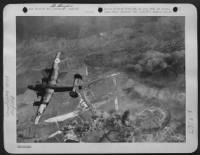 Its job well done, this U.S. Army 8th Air Force Liberator bomber turns for home, leaving the Nazi airfield near St. Dizier on the Marne burning. This twin-engine fighter base in occupied France had been used by the Nazis as a defensive airdrome, from - Page 1