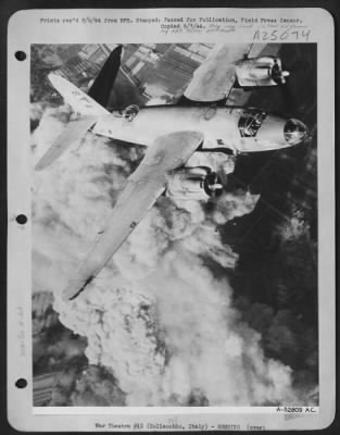 Consolidated > Leaving a towering column of smoke and debris, 8,000 feet high behind it, a Martin B-26 Marauder of the 1st Tactical Air Force heads for home after blasting a Nazi fuel dump at Collecchio in the Po Valley. This pinpoint blasting of German supplies