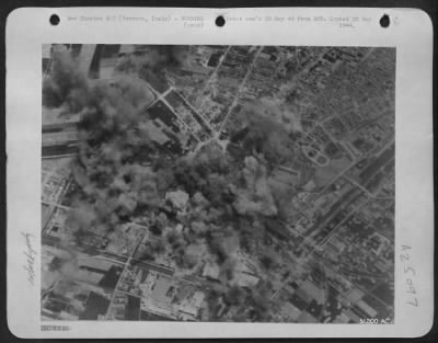 Thumbnail for Consolidated > Boeing B-17 Flying Fortresses of the 15th AAF attacked the railyards at Ferrara, north of Florence, on May 14, 1944. The tracks leading to Coparro were hit and cut, while warehouses and rolling stock in the southwest section of the yards were