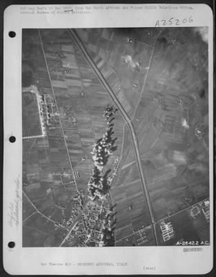 Thumbnail for Consolidated > FROM AN ADVANCED B-24 BOMBER BASE IN THE 12TH AIR FORCE, November 29---USAAF B-26 Marauders attacking the marshalling yards and airfield at Grosseto, Italy today brought back this picture of the German-held Italian city just as the