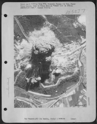 Consolidated > This photograph was taken a few seconds after 48 bombs from a Martin B-26 formation detonated an ammunition dump at La Spezia, 40 miles southeast of Genoa, Italy. Marauders of the U.S. Army 12th Air Force did the job. The streamer effects emanating