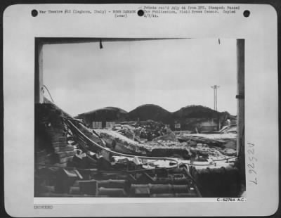 Thumbnail for Consolidated > Twisted steel and scattered debris is all that remains of the harbor facilities at Leghorn, on the west coast of Italy. This third largest port in Italy was blasted by bombers of the Mediterranean Allied Air Forces as part of the operation strangle